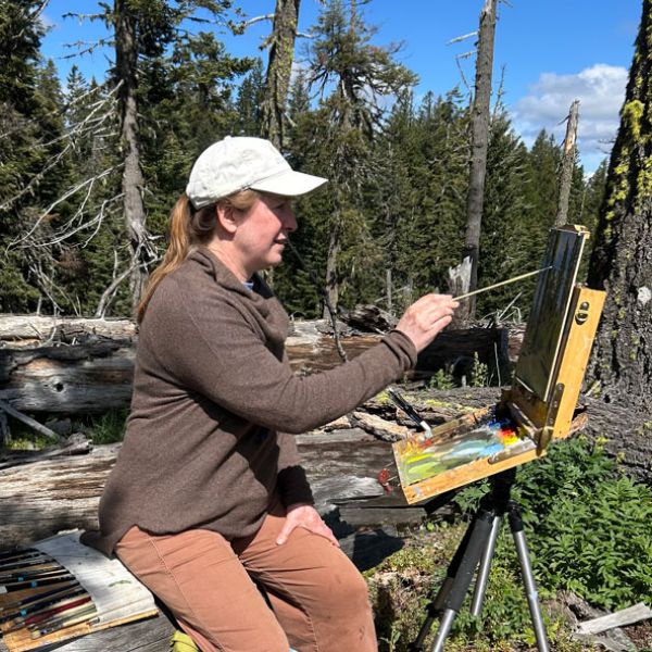 Friends Research Fund grant recipient Andrea Osbon working with a wildlife crossing camera